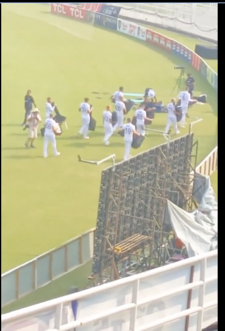 England players carry chairs 